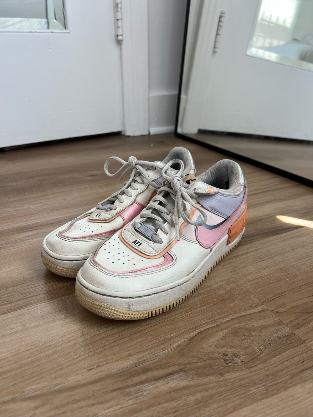 Nike Women's White Sneakers with Pink, Orange & Lavender Accents